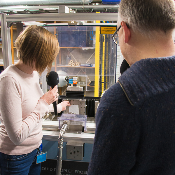 Julie demonstrating the rain making machine